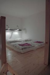 Bed in 10-Bed Dormitory Room with Shared Bathroom