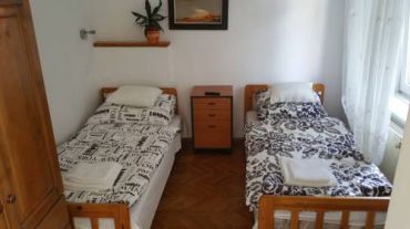 Двухместный номер с 2 отдельными кроватями и собственной внешней ванной комнатой